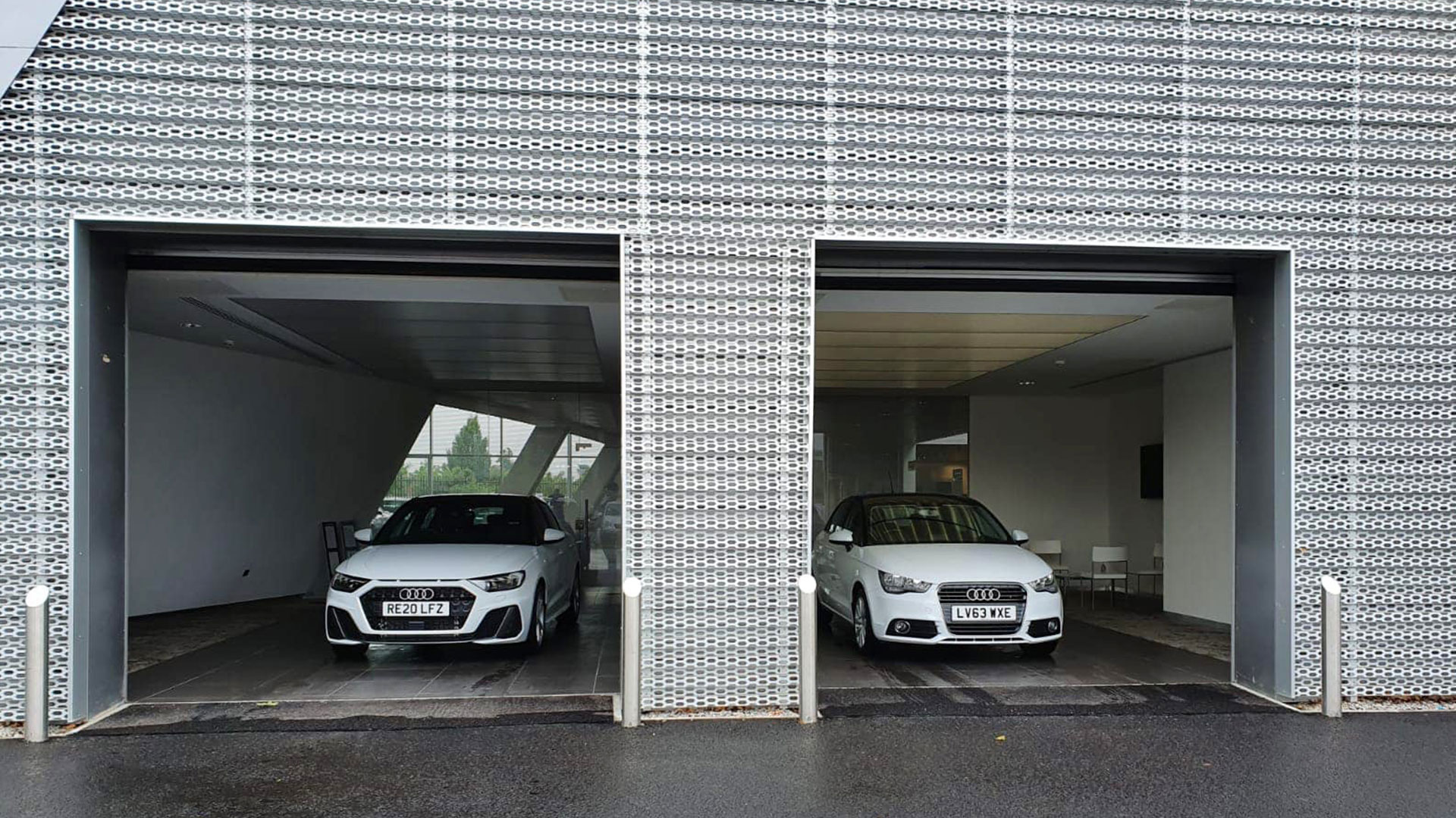 Baynham Meikle Audi dealership Farnborough with two Audi vehicles in shot